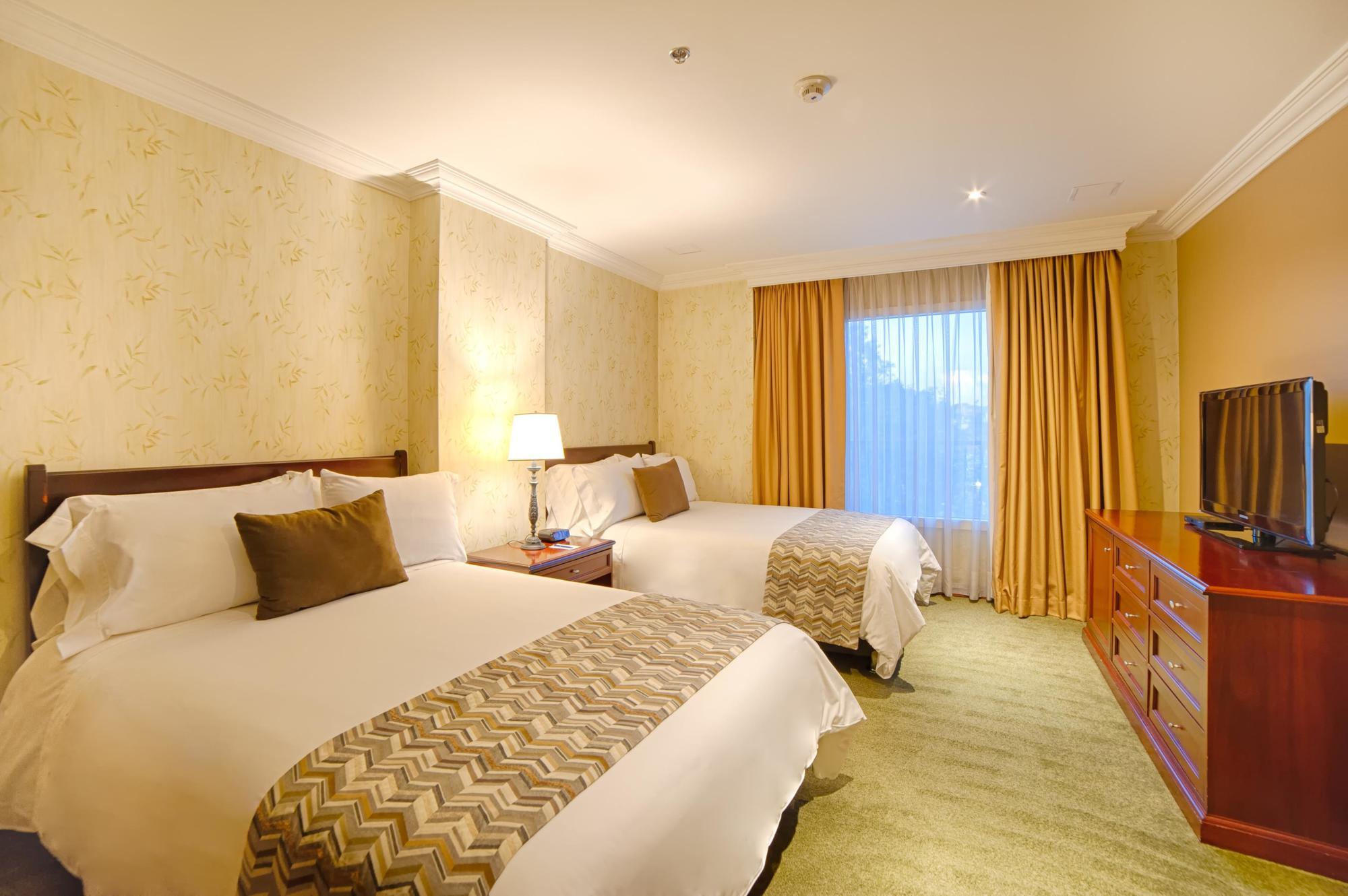 Casa Dann Carlton Hotel & Spa Bogota Buitenkant foto A guest room at the hotel